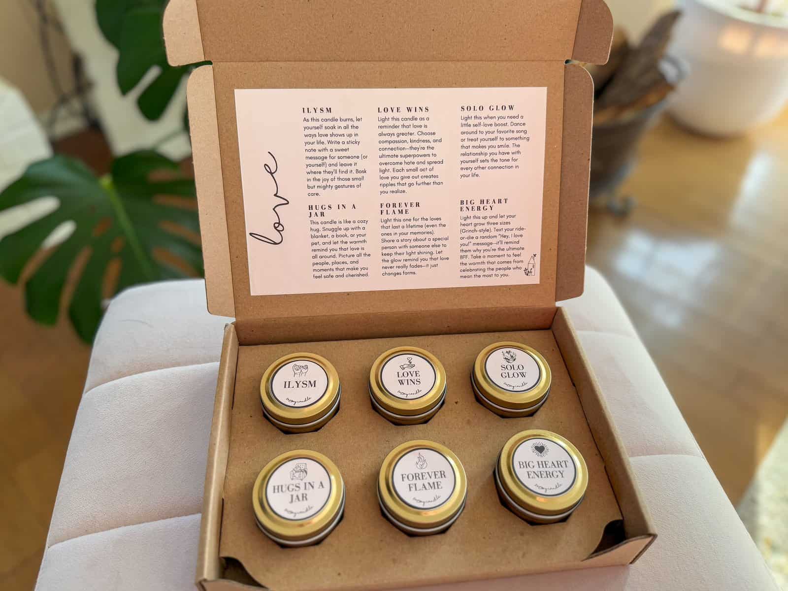 unicorn-scent candle from the Love Candle Mood Box creating a cozy, romantic ambiance.